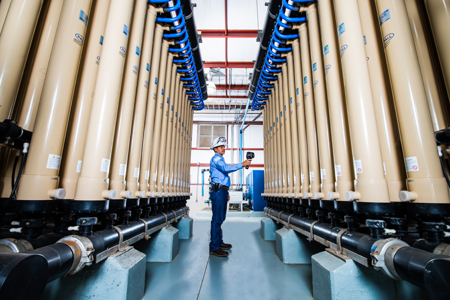 An operator inspects the reverse osmosis membrane array at the SRWA plant
